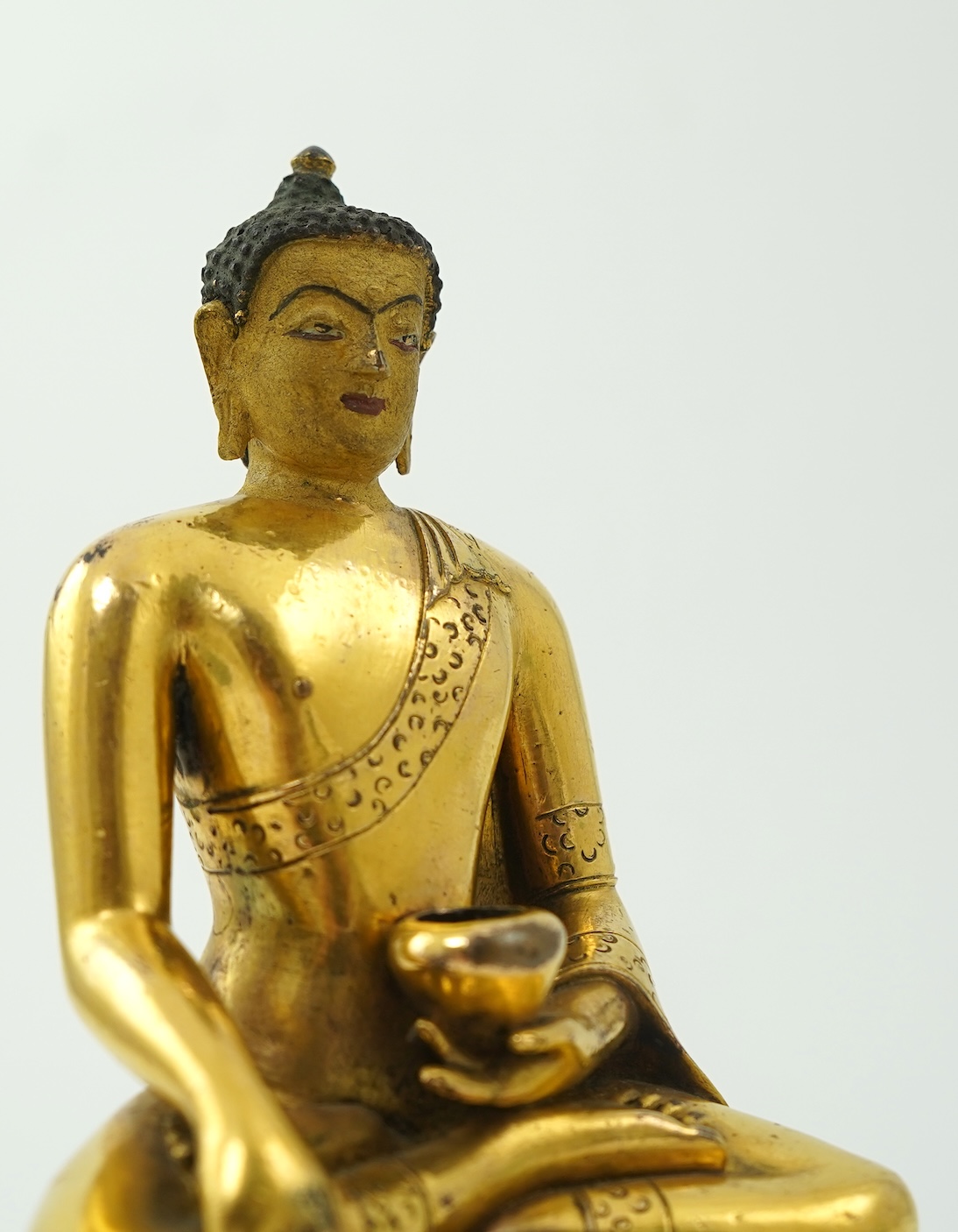 A Mongolian gilt-bronze figure of Buddha Shakyamuni, possibly 18th century